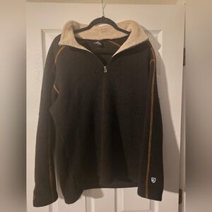 Kuhl Men's Europa 1/4 Zip fleece sweater in a black/brown color with a shearling